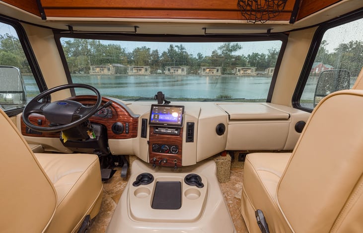 Driver's seat. Both front seats can swivel for convenient extra seating when parked. There's also a post and oval table that can be installed between the 2 seats when parked.