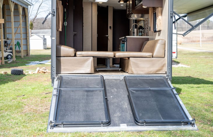 Ramp down with porch/deck railing on.  Removable when loading your toys