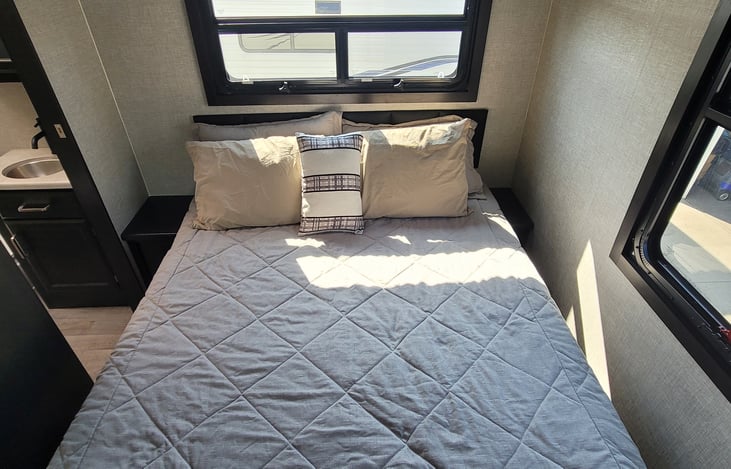 Queen bed with night stand on both sides