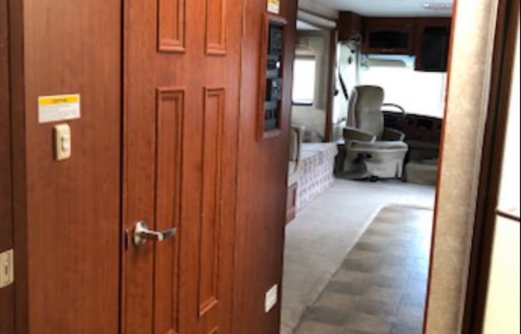 A Private area between kitchen and bedroom for bath and shower.