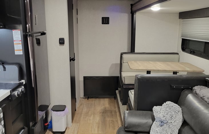 Dining and living room area (note: TV is mounted where you see the little square mount on the wall)