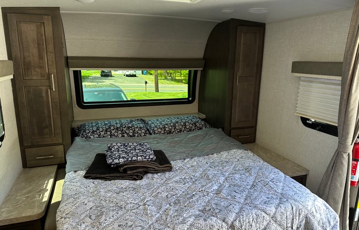 Master Beddrom Area - Queen Murphy Bed with Sheets, 2 pillows, bed throw and extra 2 blankets, his/her closets with hengers and drawers, window and skylight.