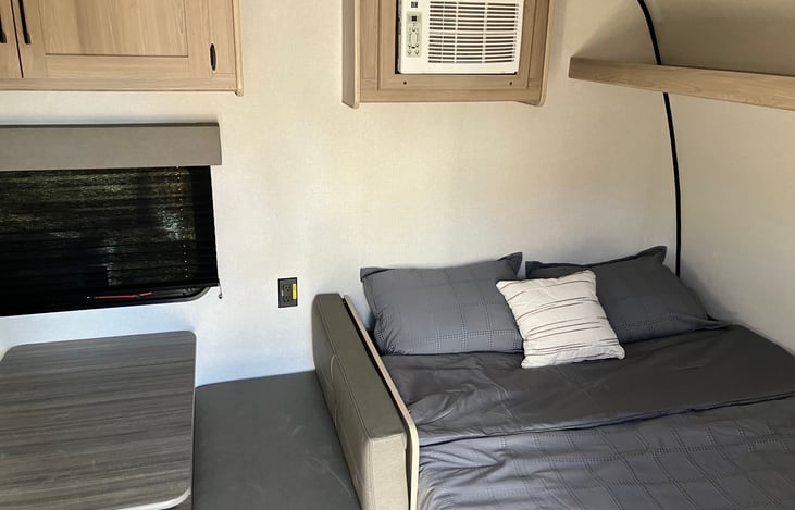 Queen bed with storage above and below