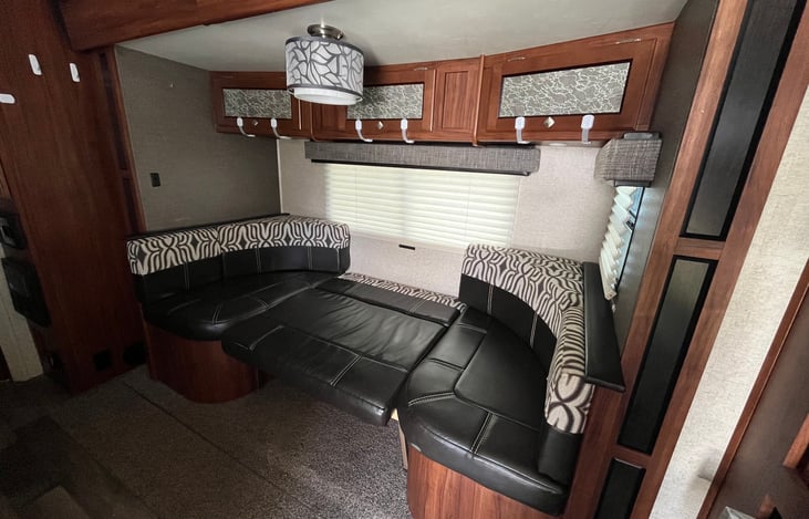 Slide out, bed, sofa/dinner table.