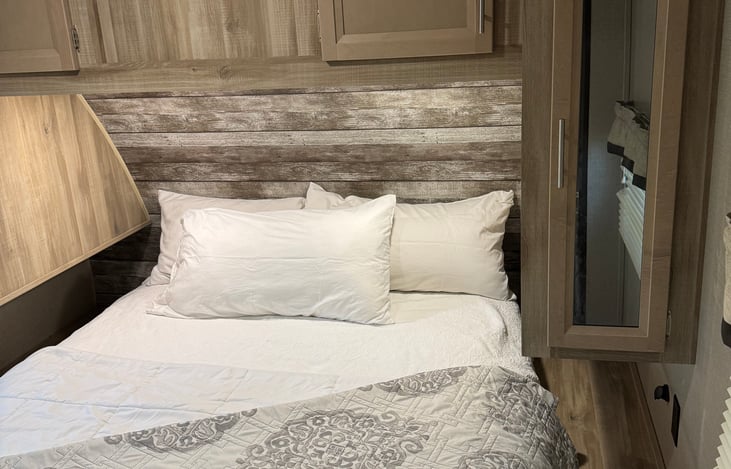 Queen bed with foam topper and lots of storage area