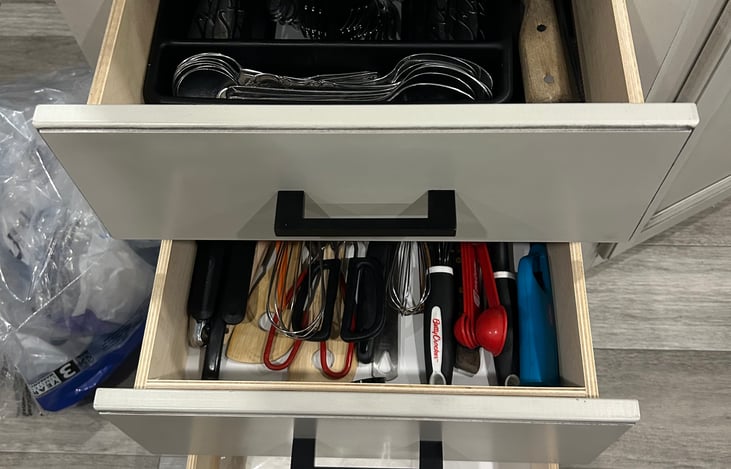 Fully stocked dinnerware, cookware, pot holders, extra dish clothes and towels and napkins.