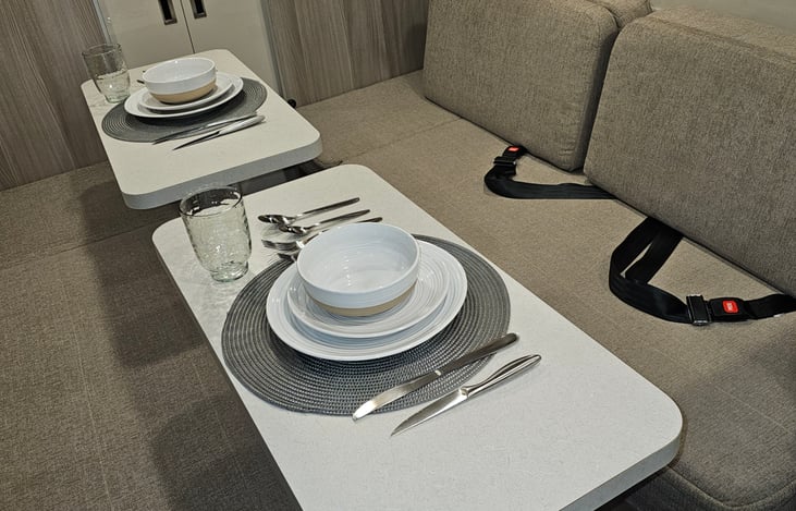 Full place setting for two. Photo demonstrates upgraded stoneware dishes.