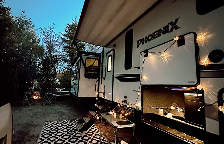 The perfect campsite setup!  Rental includes a camp kitchen, two chairs, and an outdoor rug.   You can also set up the optional twinkle lights for evening ambiance.