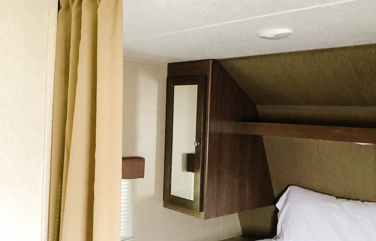 Storage shelf above Queen bed