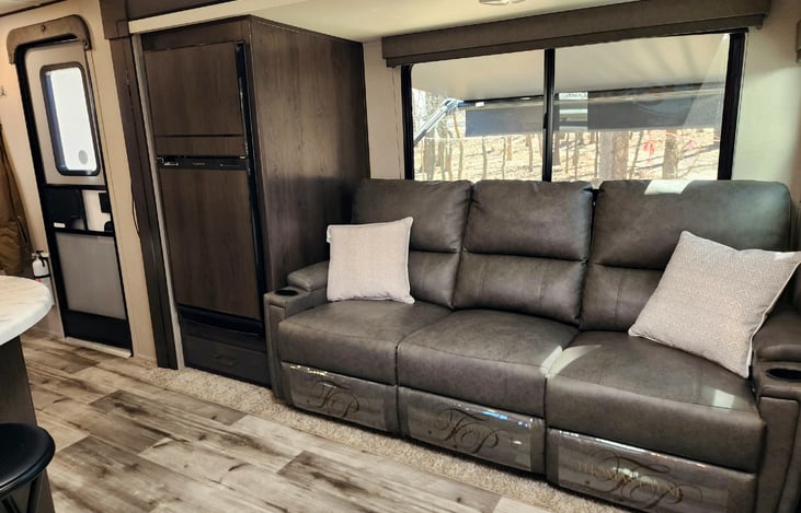 The 12V fridge/freezer holds plenty of food for the whole family. Plus since it is 12V, it can run while you are driving down the road and cools in less than half of the time of an old RV fridge.