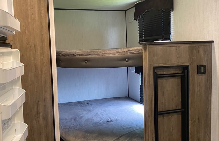 The Bunkhouse has black-out curtains and lights. Both are double beds with accessible ladder for top bunk and extra storage under bottom bunk.
