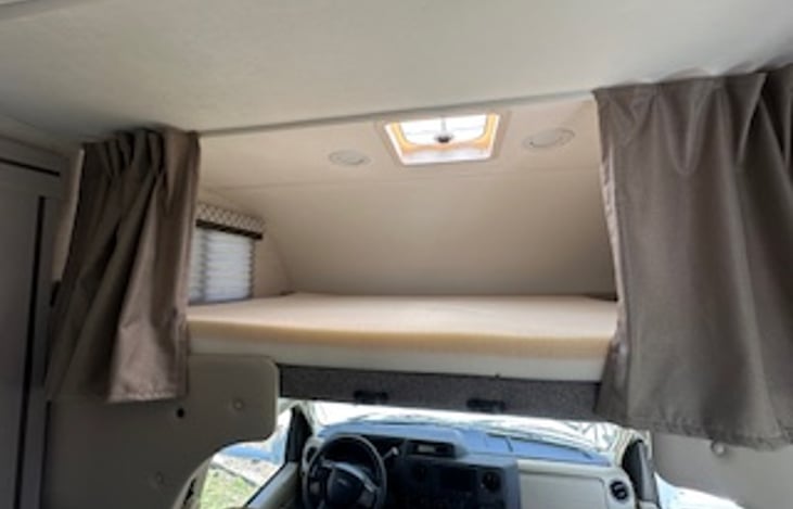 Over the cab bed with 4 inch memory foam mattress topper.