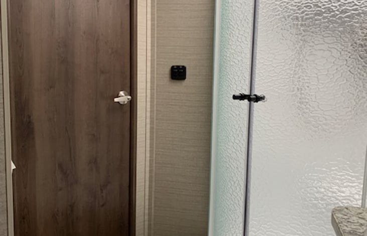 Door from bathroom to kitchen.