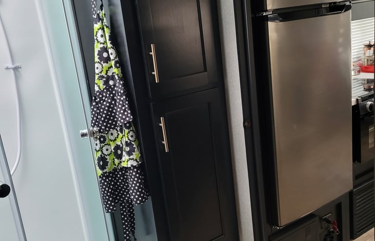 Lots of storage. These cupboards are convenient for pantry items top cabinet has clothing rod.