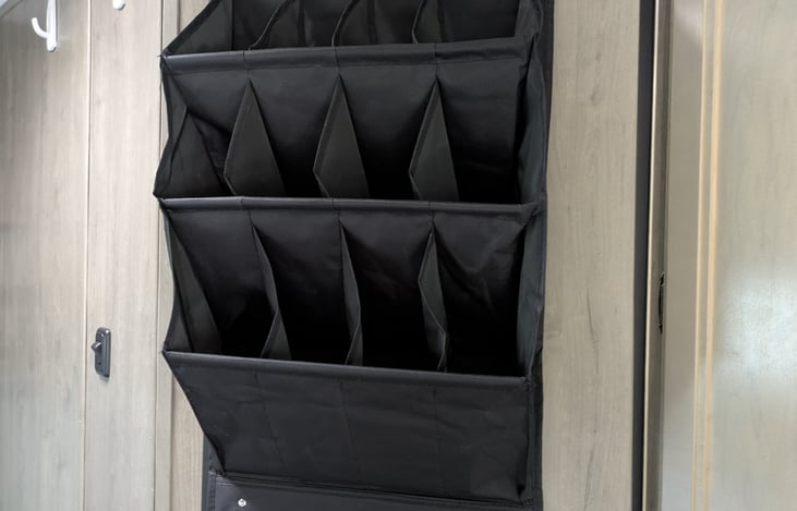 organizer hangs on the bathroom door either on the outside or inside of the door. Great for shoes, Toys, or whatever you want to have easy access to.