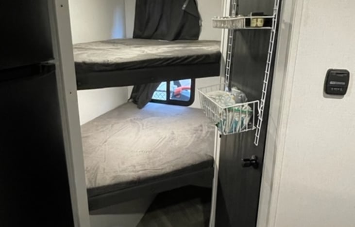 2 full bunk beds. Please note RV beds are a hair smaller than typical beds. Our 12 and 8 year old sons fit in 1 bunk together. USB power and above lighting in each bunk.