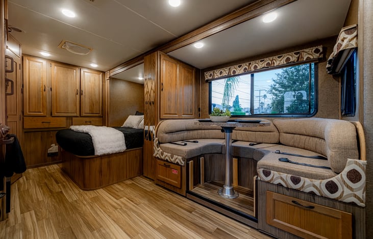 Spacious dining area with large windows that easily converts into an extra sleeping space