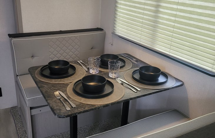 dining table that lowers for extra sleeping bed