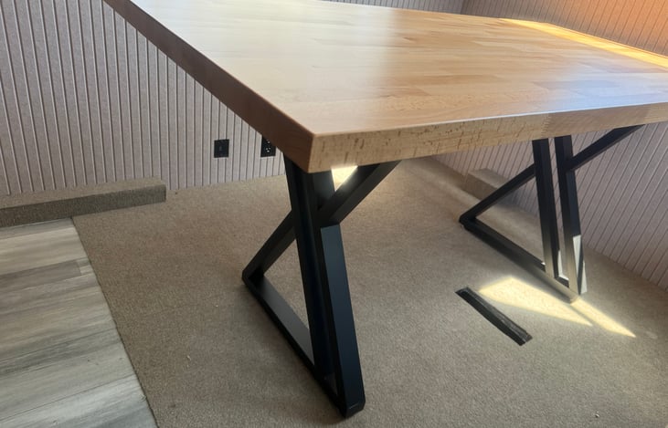 Beautiful table, movable, and carpet installed on this end of the camper.