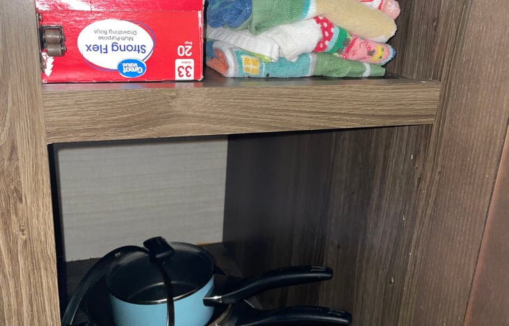 Pots/pans and kitchen towels.