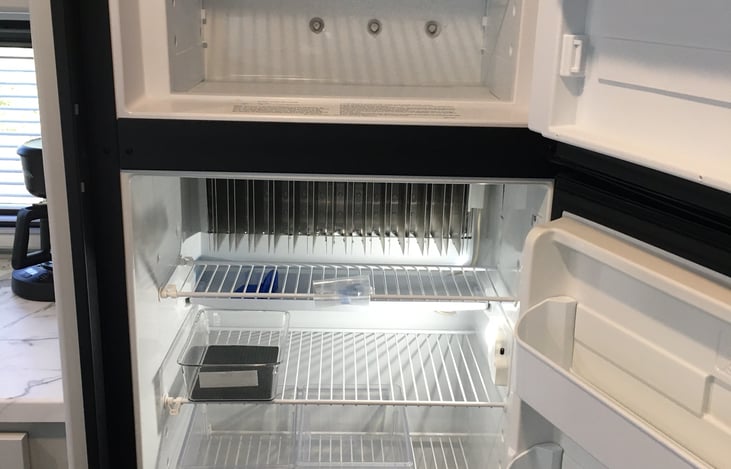 The mid-sized fridge and freezer have organizer bins and offer plenty of space for your food. The door has multiple bins and can store condiments, juice containers, pop, and much more.