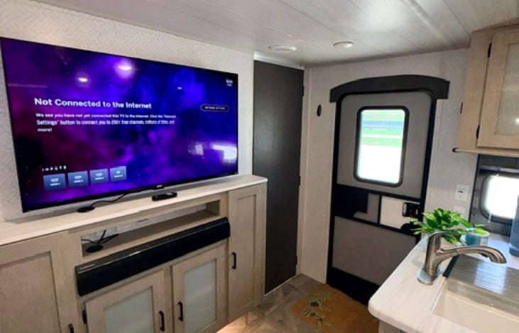 Smart TV mounted with blue-tooth speaker