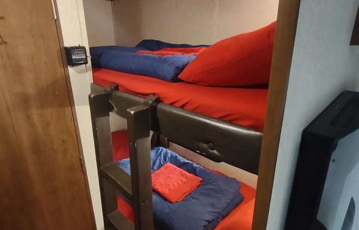 Twin bunks, lower with window. Ladder for kids to call "top bunk!"