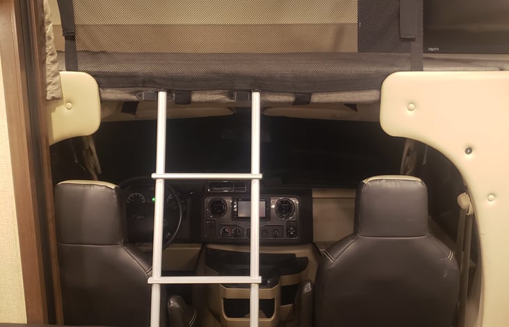 looking onto the back of driver/passenger
with ladder for the bunk above sleeps 2