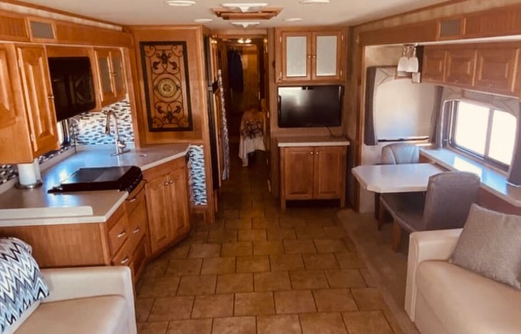 Rear view of kitchen, dinette, and back bedroom