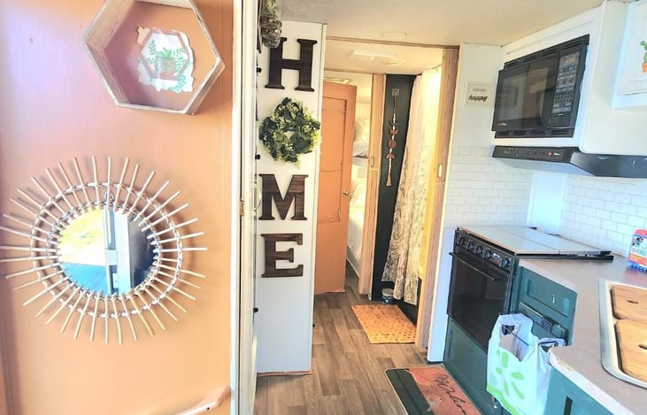 This is as soon as you walk in and look to the left. The tan door in the background is the inside of the bathroom door. Which is usually shut.