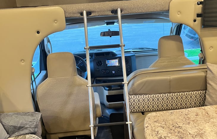 Driver's cabin with removable ladder. Back up camera built into the radio