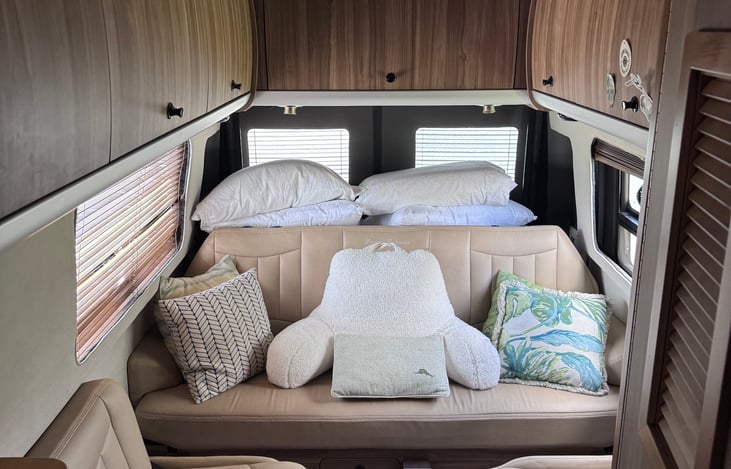 Facing rear of coach. Traveling couch lays down to bed.