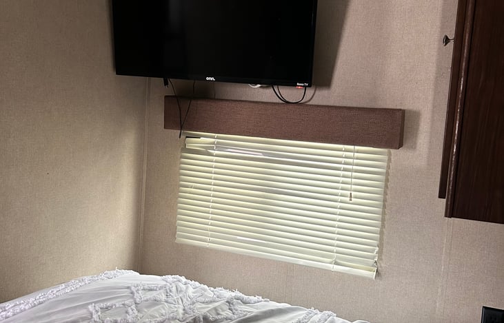 TV with ROKU in bedroom 
There is also a TV by couch (Amazon Fire TV stick)