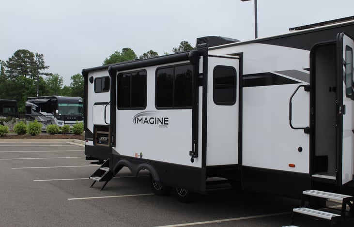 Facing the Front Right of the RV with slideouts extended.