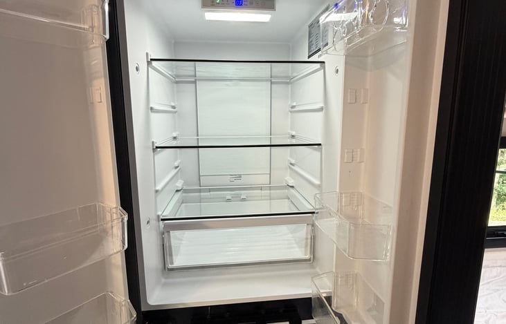 Large Fridge and a Freezer below. Runs off of the RV Battery when not hooked up to Shorepower.