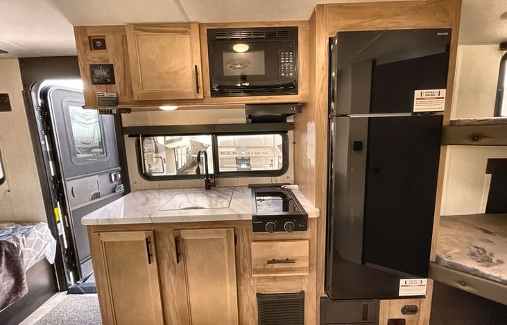Kitchen with Sink, Fridge, Stove, and Microwave