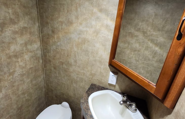 Bathroom sink (cabinet space underneath), vanity with storage, and sink.