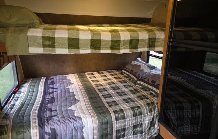 The queen size bed with the fold-down twin bunk above.  the bunk can be folded up and converted to a full width storage cabinet if you are a party of less than four.