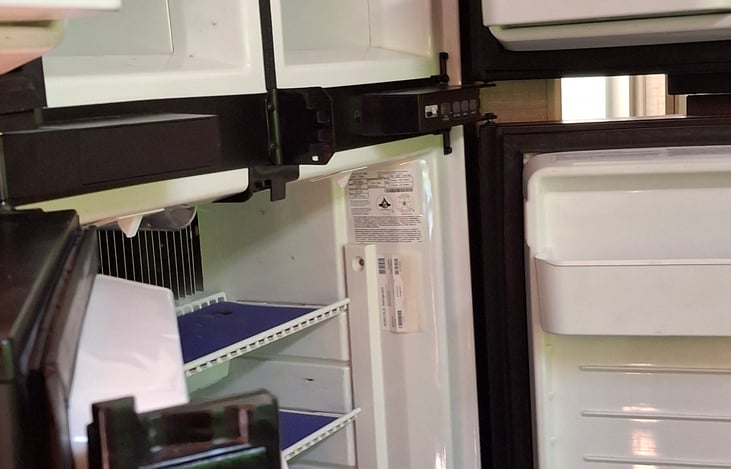 large four door frig/freezer/ Run on propane or electric