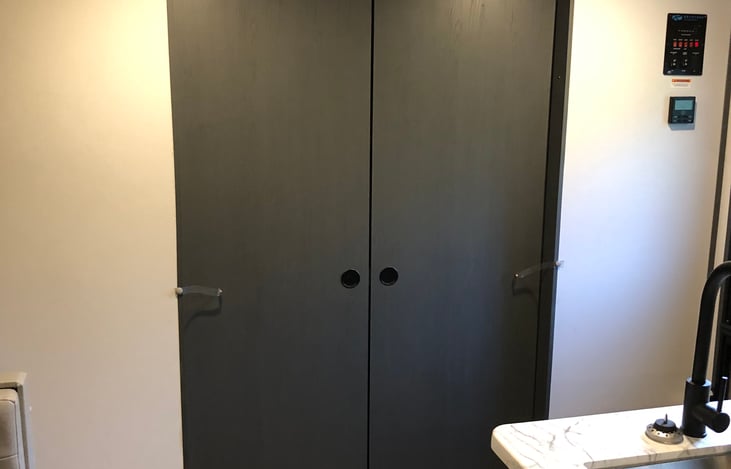 Sliding doors that close off the master bedroom for privacy.