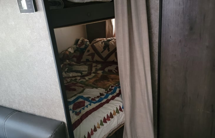 Full Size Rear Bunks next to the bathroom
