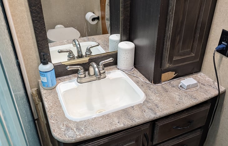 Main bathroom sink and cabinets.