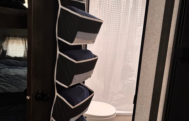 Fresh towels and wash cloths on the bathroom door