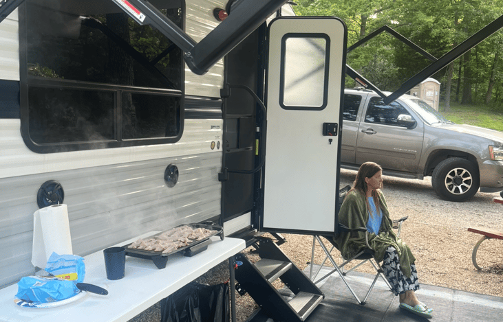 Frying up some bacon for  breakfast on the griddle, which comes with the camper for you to use