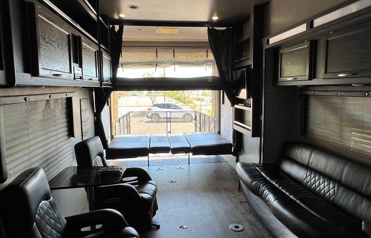 Two full bunk beds in the rear bottom flips up to a dinette set