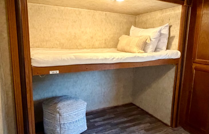 Back bedroom with one bunk and plenty of storage