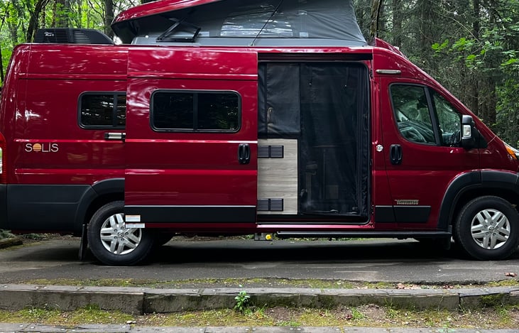 Here is Clifford with the side door open, the full screen down, and the pop top opened.  Lay up there and enjoy the breeze!