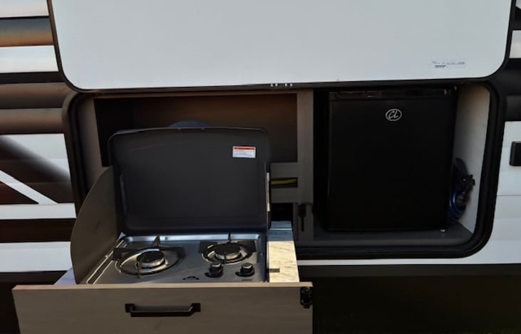 Outdoor cooktop and mini fridge.  Because dinner always taste better outside.