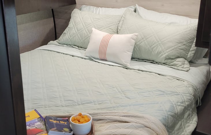 Queen size bed - the perfect spot to relax after a fun day camping!