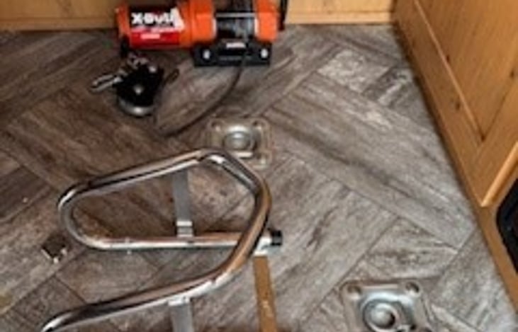 Remote controlled winch and Pingle removable chock for toy loading assistance